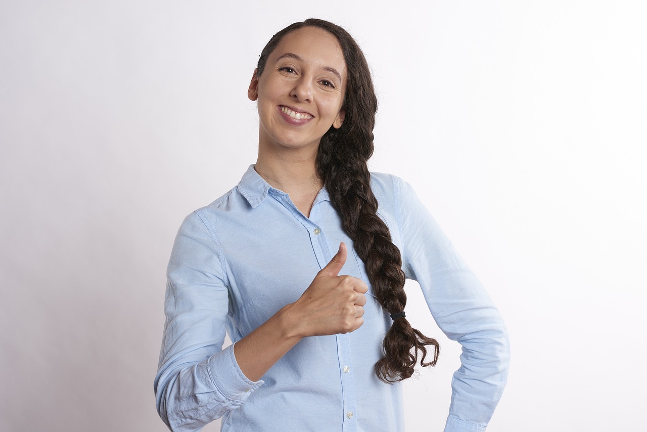 Professional giving a positive gesture while working online